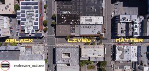 aerial view of yellow Black Lives Matter mural on Oakland street